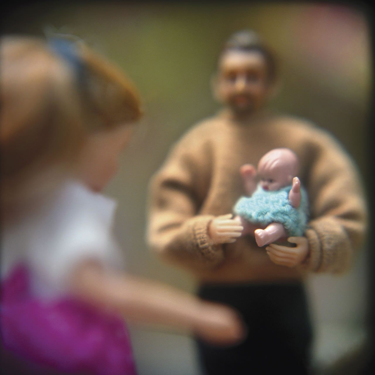 family with infant: from Hurricane Story, a series of Holga images about Hurricane Katrina